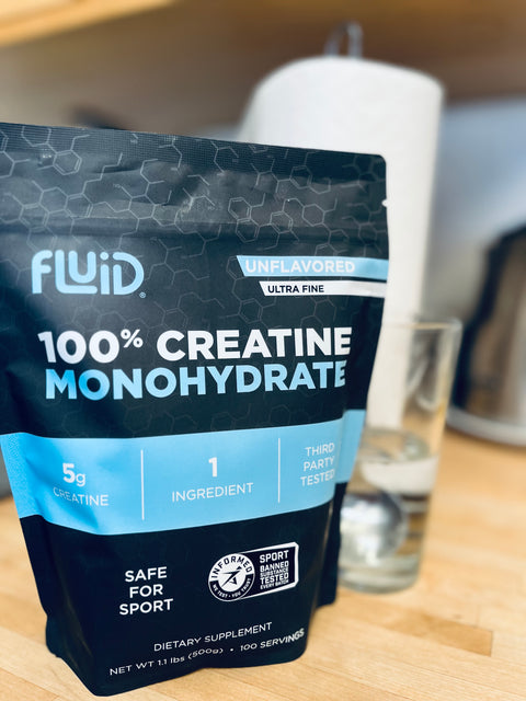 Fluid 100% Creatine Monohydrate bag on a table