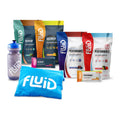 Collection of Fluid sports drink packages and a water bottle for Live Fluid Package