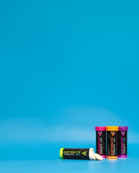 Fluid Tactical Electrolyte Tablets on a blue background